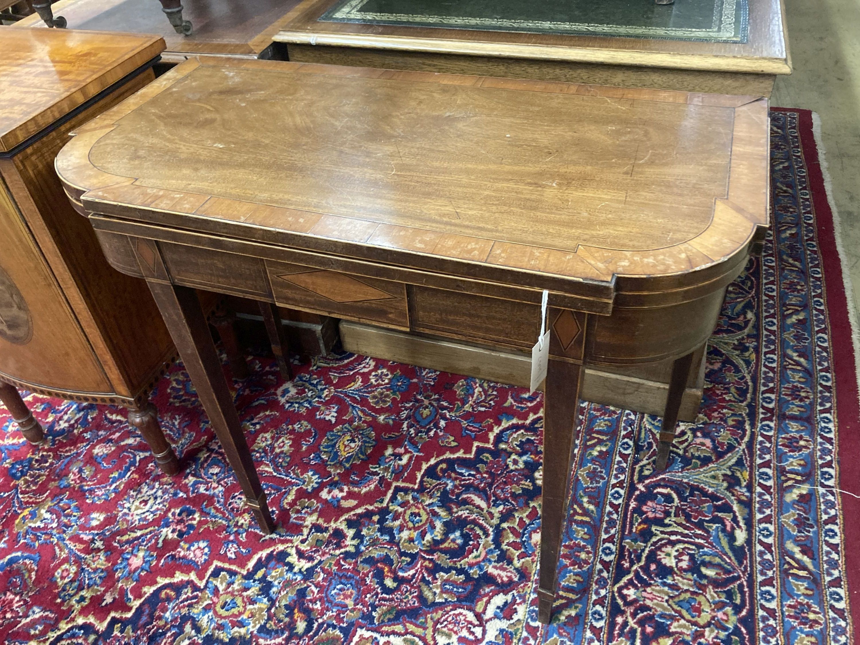 A George IV satinwood banded folding mahogany card table, width 90cm, depth 44cm, height 74cm